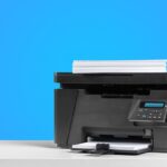 black office printer with blue background