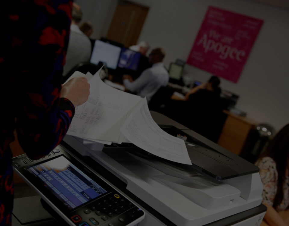 apogee office employees woman using printer photocopier