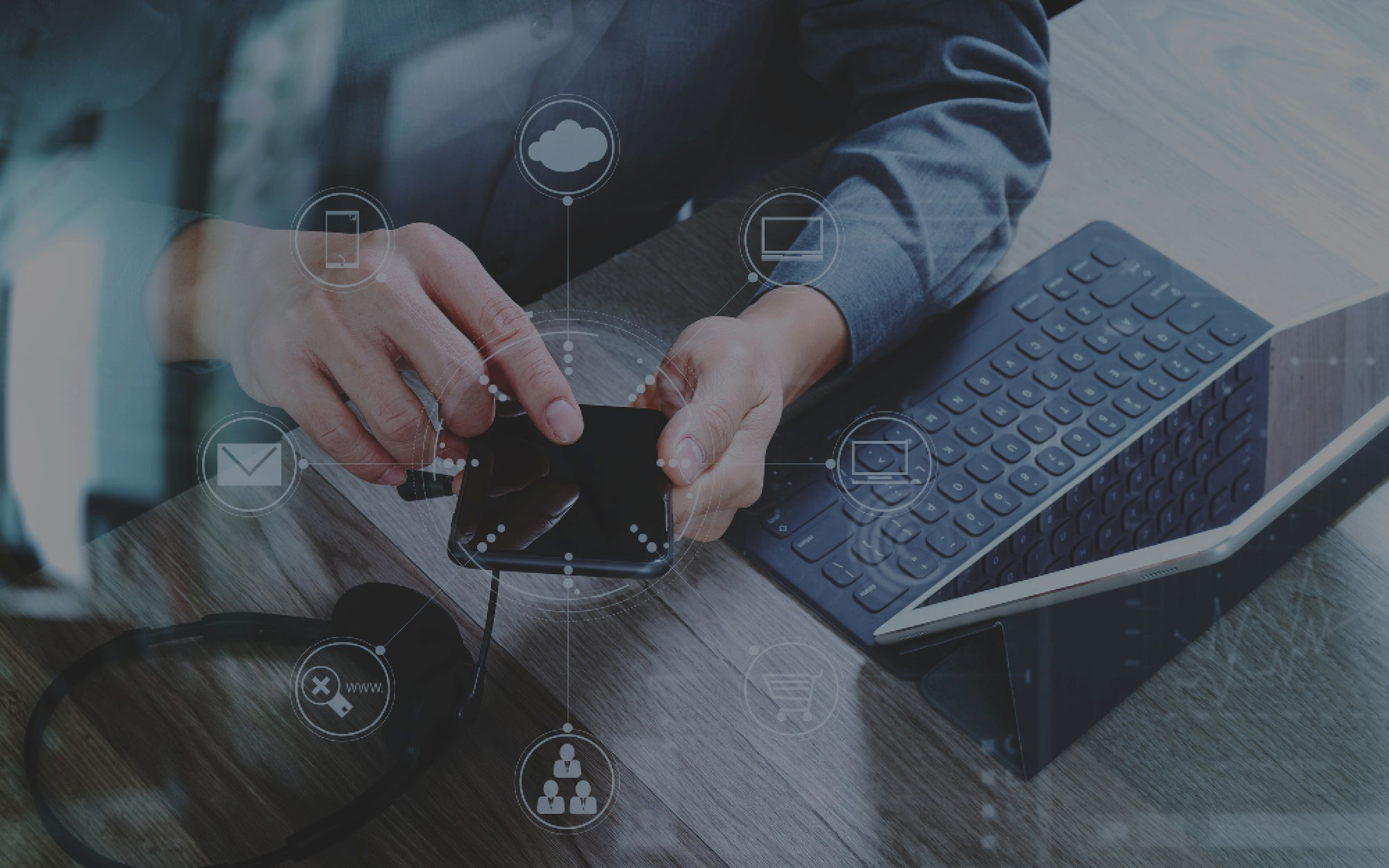 man using smart phone dark overlay icons circles laptop