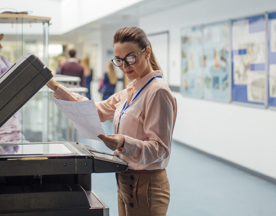 banner adult woman in school using printer photocopier