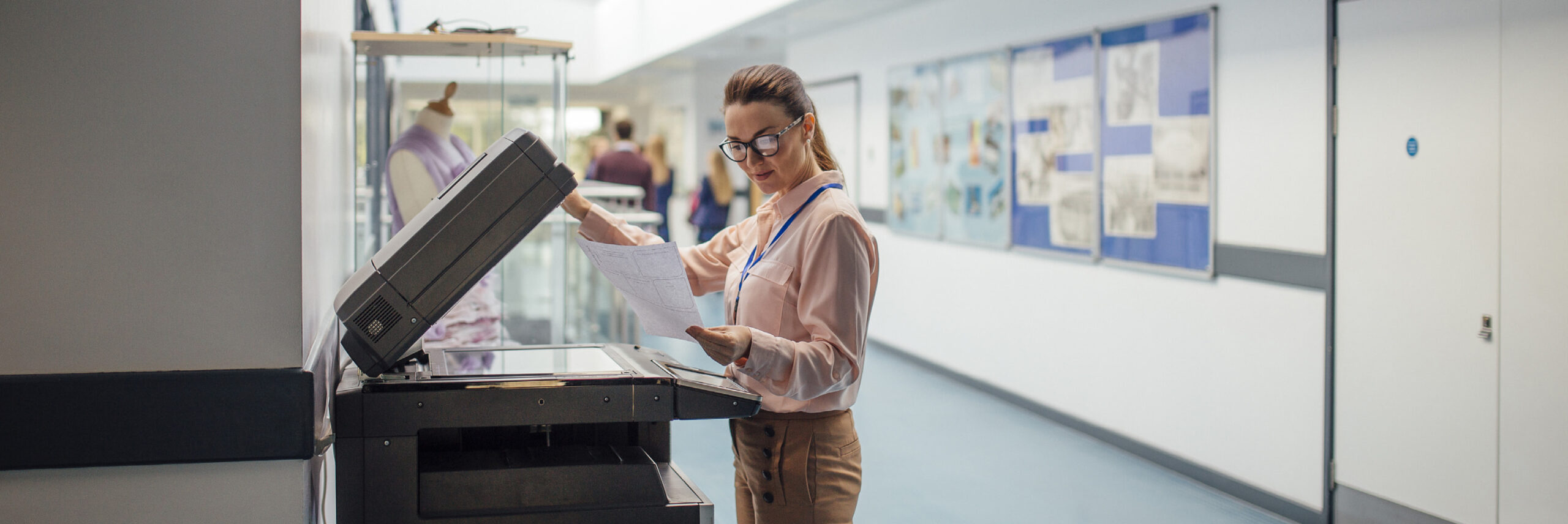 banner adult woman in school using printer photocopier