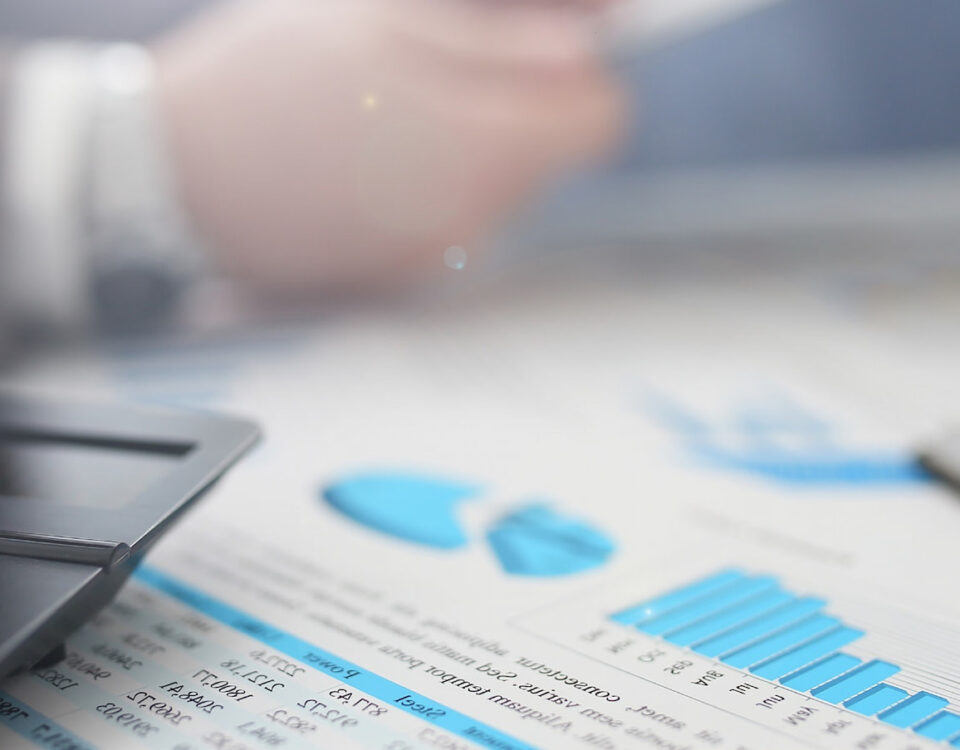 financial calculator graphs charts on office desktop