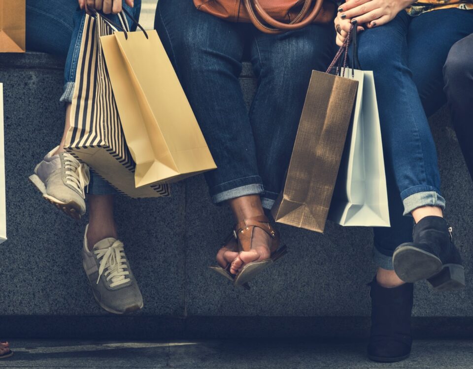 french connection shoppers holding bags