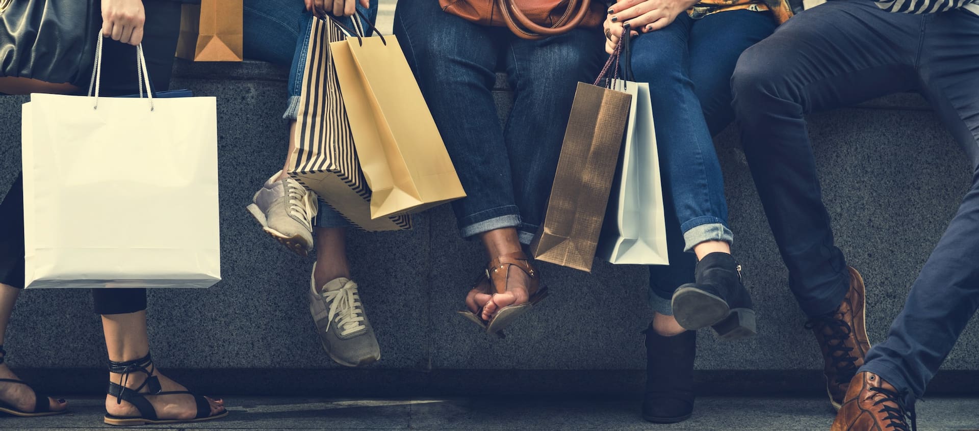 french connection shoppers holding bags