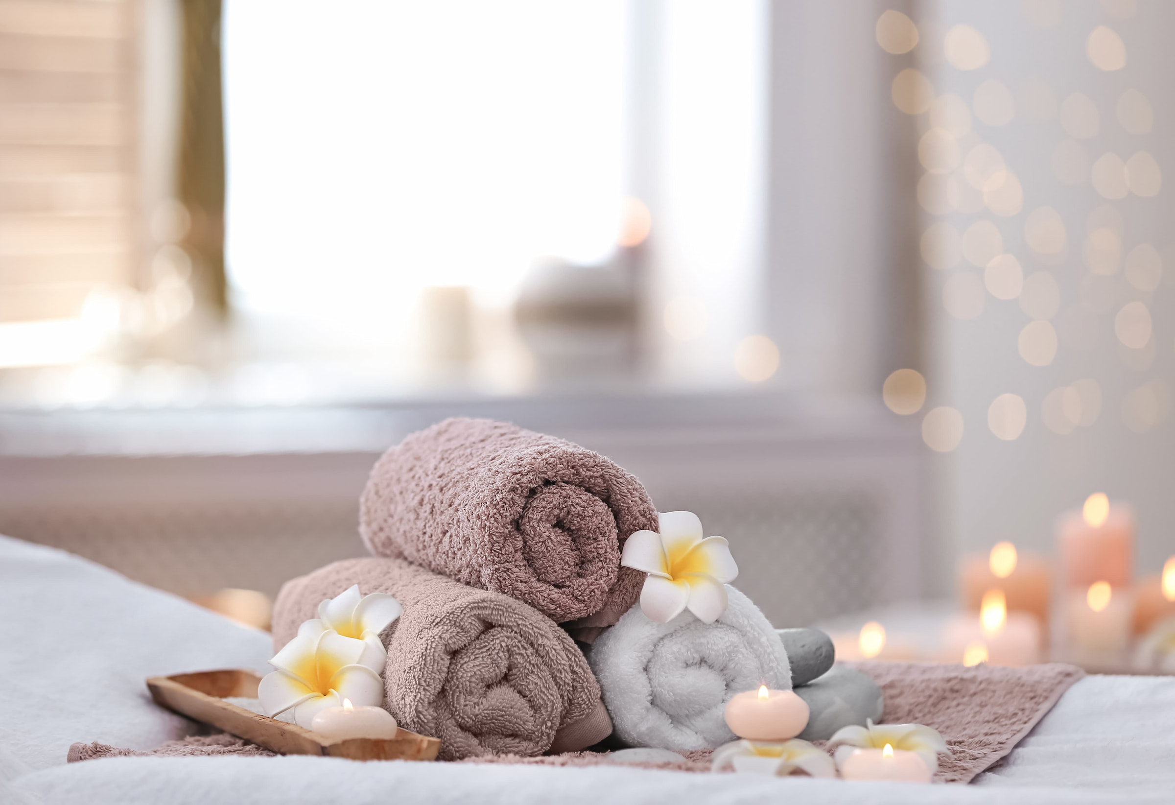 hotel spa rolled towels soaps candles luxury