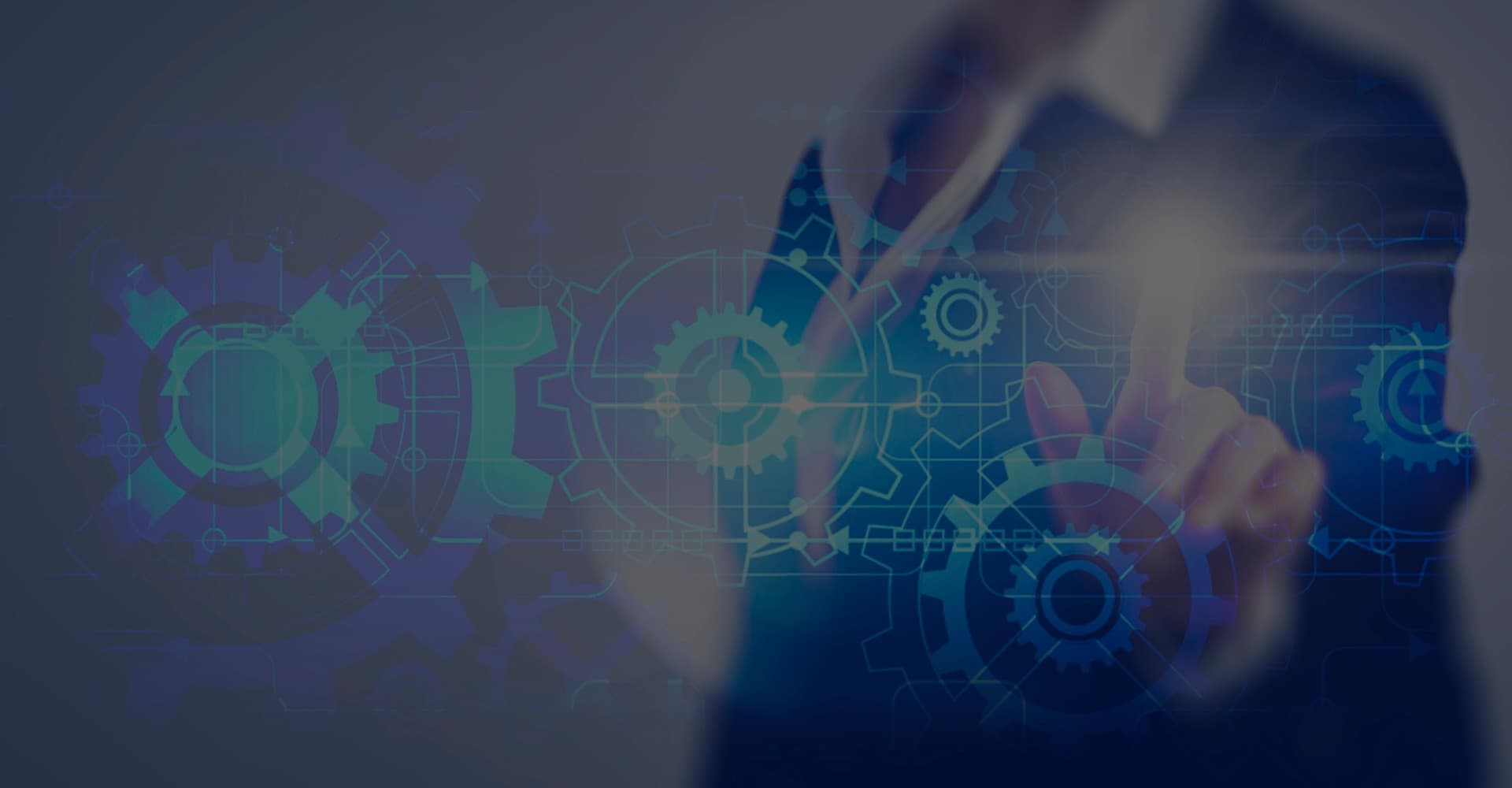 A person touching a screen with illuminated machine cogs.