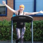 Apogee employee on treadmill for marathon weekend charity challenge