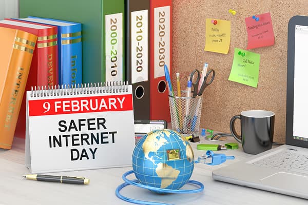 Home office laptop sign for safer internet day on the calendar