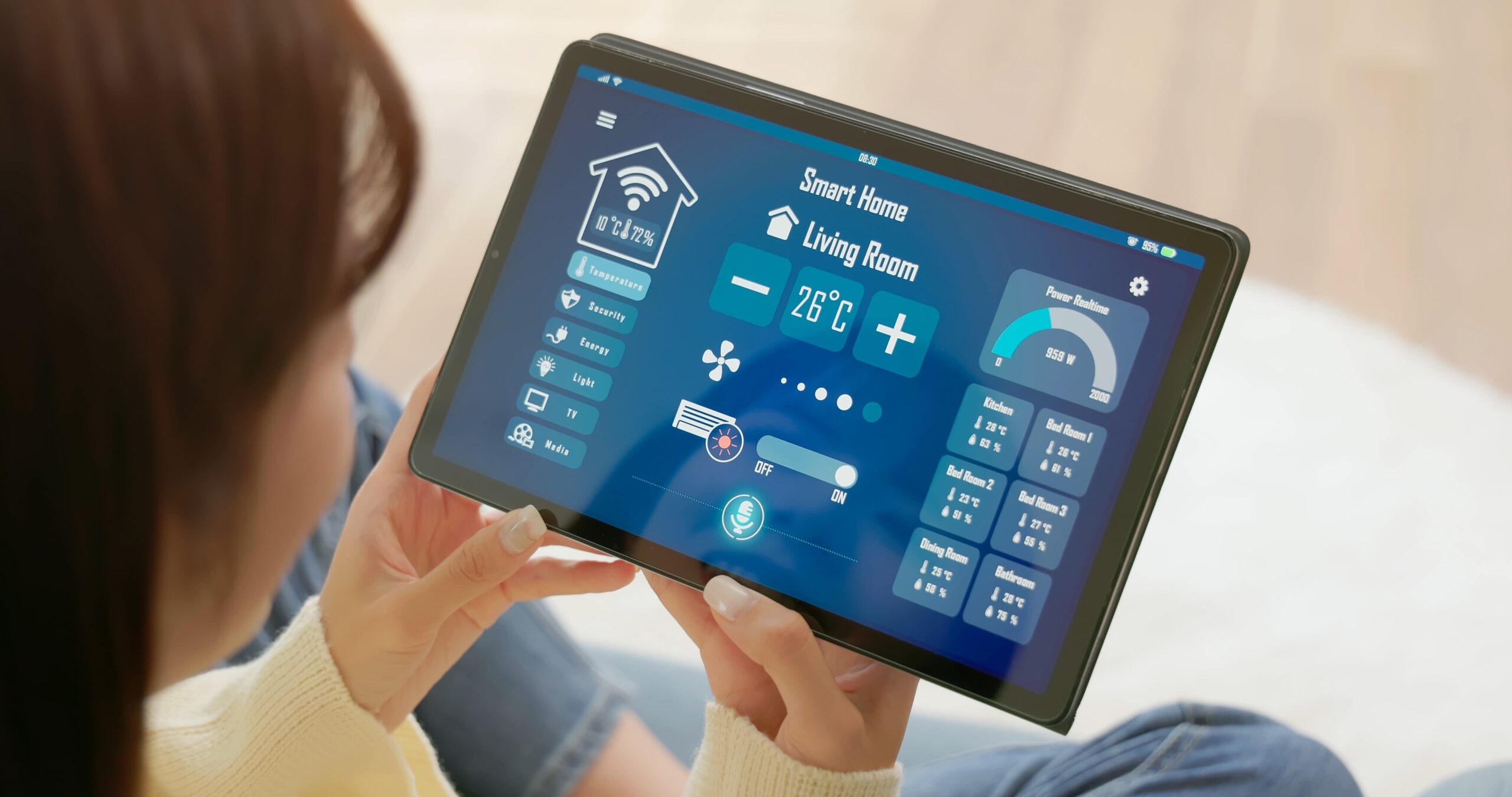 woman holding iPad, which is connected to her entire smart home