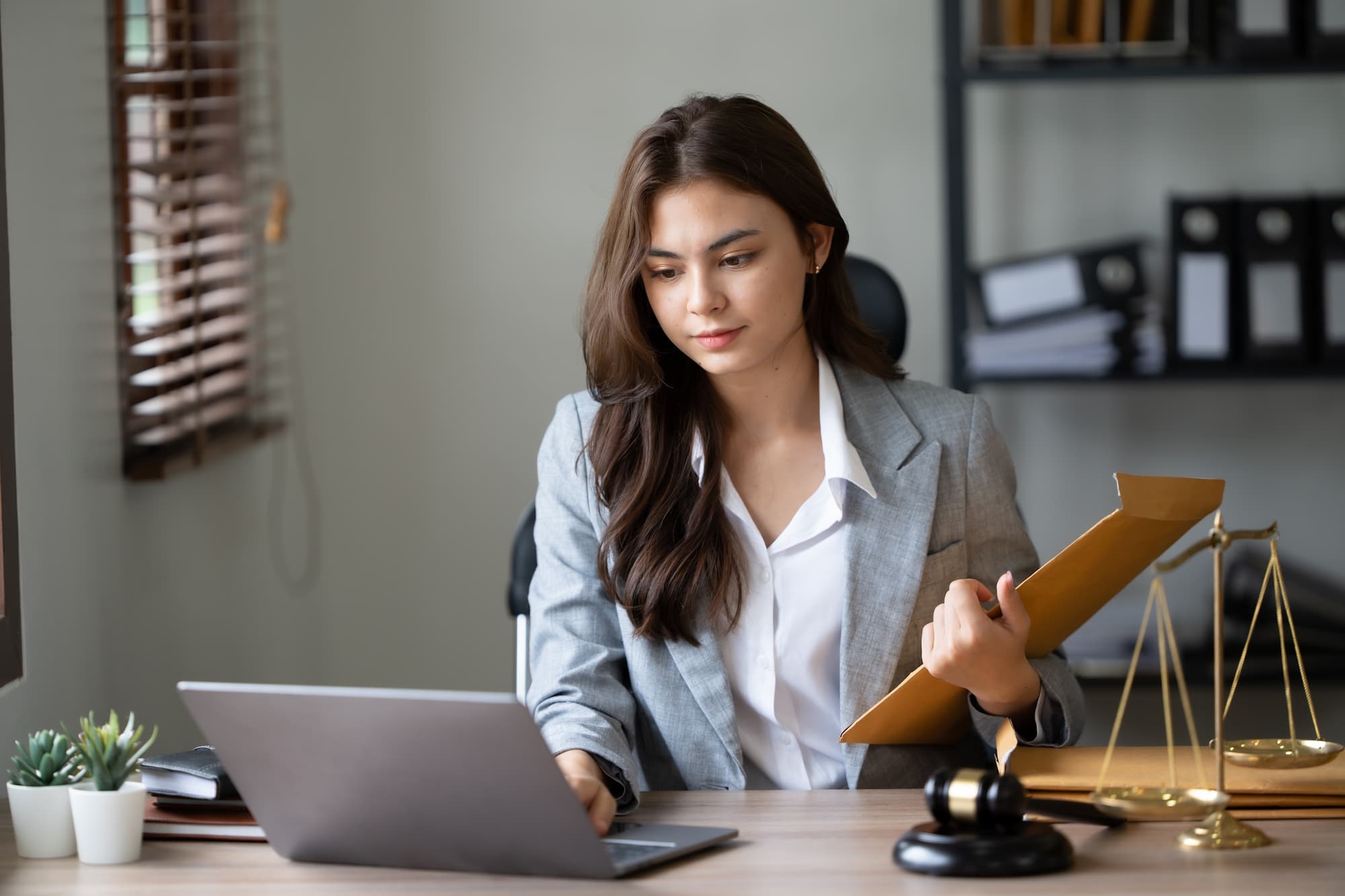 lawyer working with software on laptop