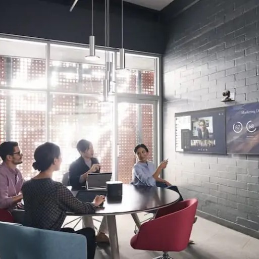 conference room stone wall video meeting round table