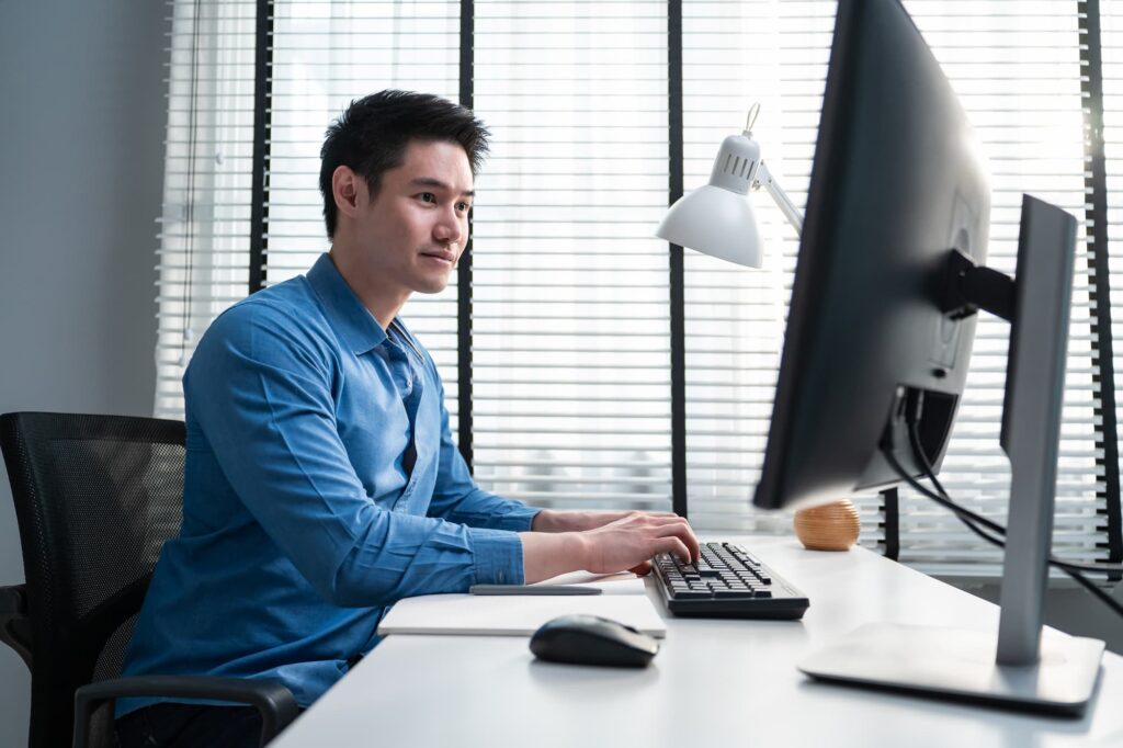 employee works on desktop computer