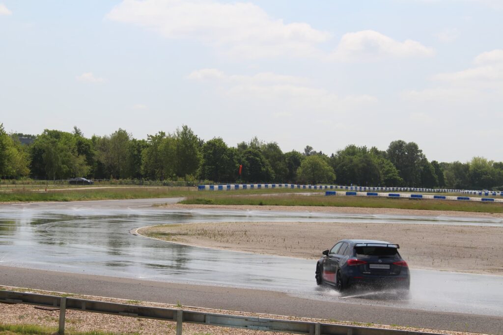 mercedes 63AMG driving around test track mercedes-benz world