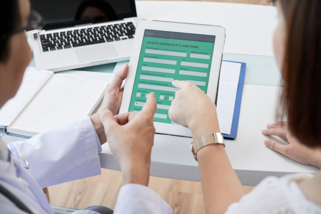 patient filling health insurance claim eform