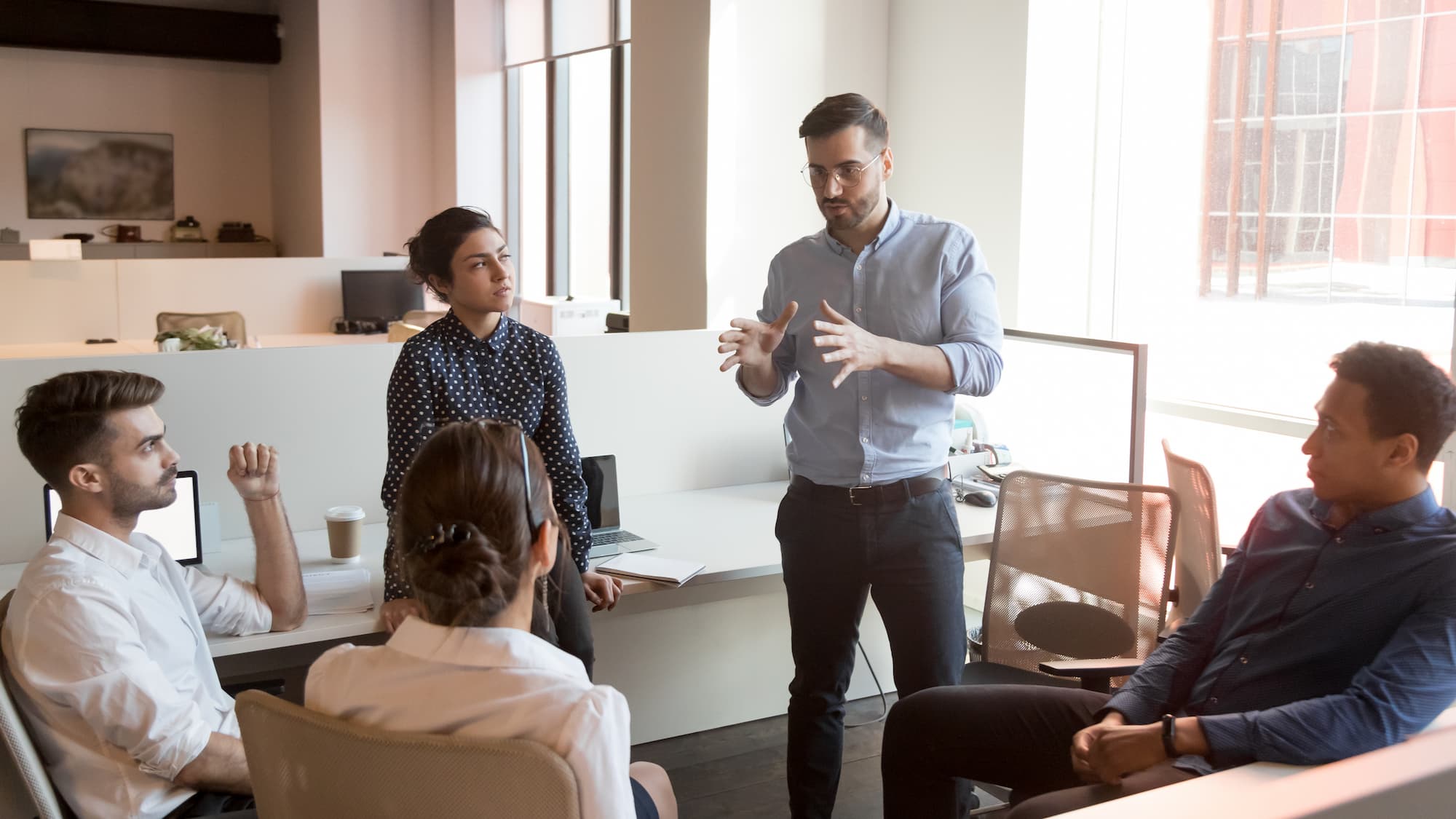 young apprentices collaborating in office space