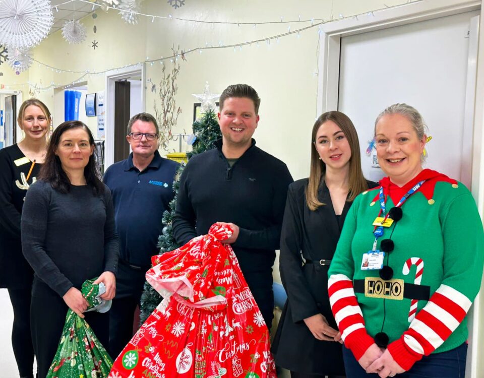 apogee employees giving presents to maidstone tunbridge wells hospital childrens ward