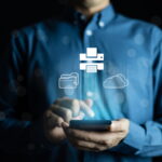 man in blue buttoned shirt using smartphone to manage cloud and printer